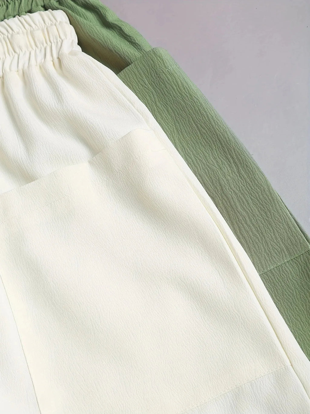 A 2-piece set of solid color casual drawstring shorts with pocket beach pants for women in 2026