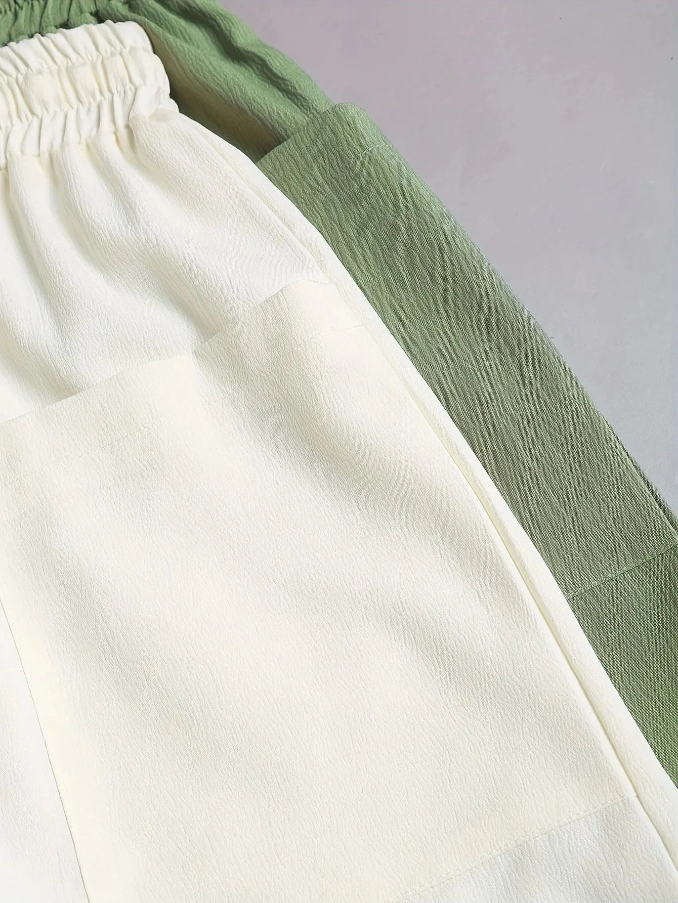 A 2-piece set of solid color casual drawstring shorts with pocket beach pants for women in 2026